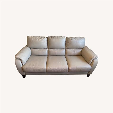 5" Inside arm to arm 75". . Raymour and flanigan leather sofa